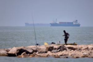 Iranian drones attack Bahrain and a ship is struck in the strait after U.S. airstrikes