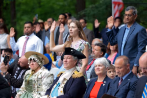 Gov. Shapiro welcomes 63 new U.S. citizens from 17 countries in Chesco alongside a George Washington reenactor and bald eagle