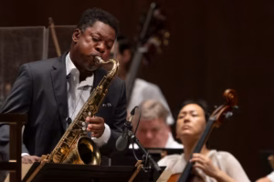 Ravi Coltrane joins ‘one of the greatest orchestras in the history of the world’ to celebrate his legendary father’s 100th birthday