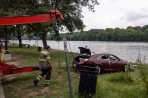 Two elite rowers and some good Samaritans rescued a man who drove into the Schuylkill
