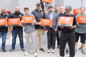 Who’s behind the orange signs around Philly criticizing rogue developers?