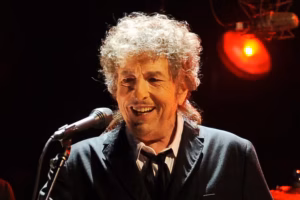 Bob Dylan and his ever-changing band, sang in the shadows at the Highmark Mann