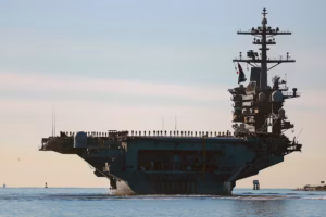 Top U.S. commander visits aircraft carrier, Gaza talks continue in Egypt